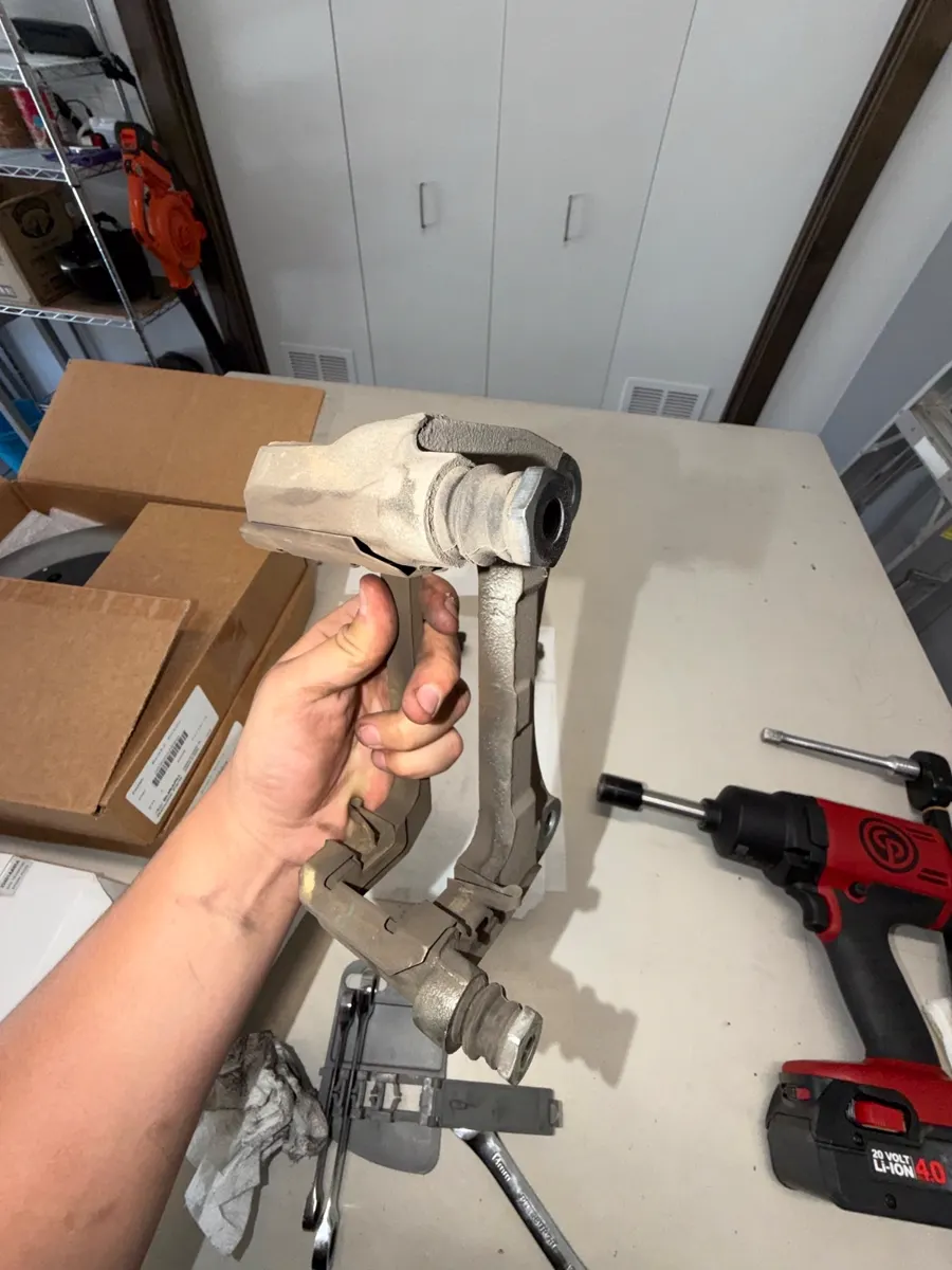 Cleaning the caliper bracket before reassembly