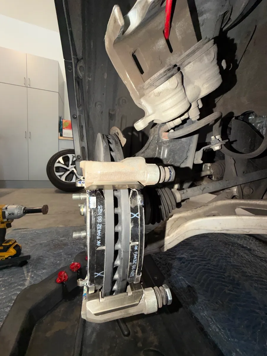New pads in the caliper bracket