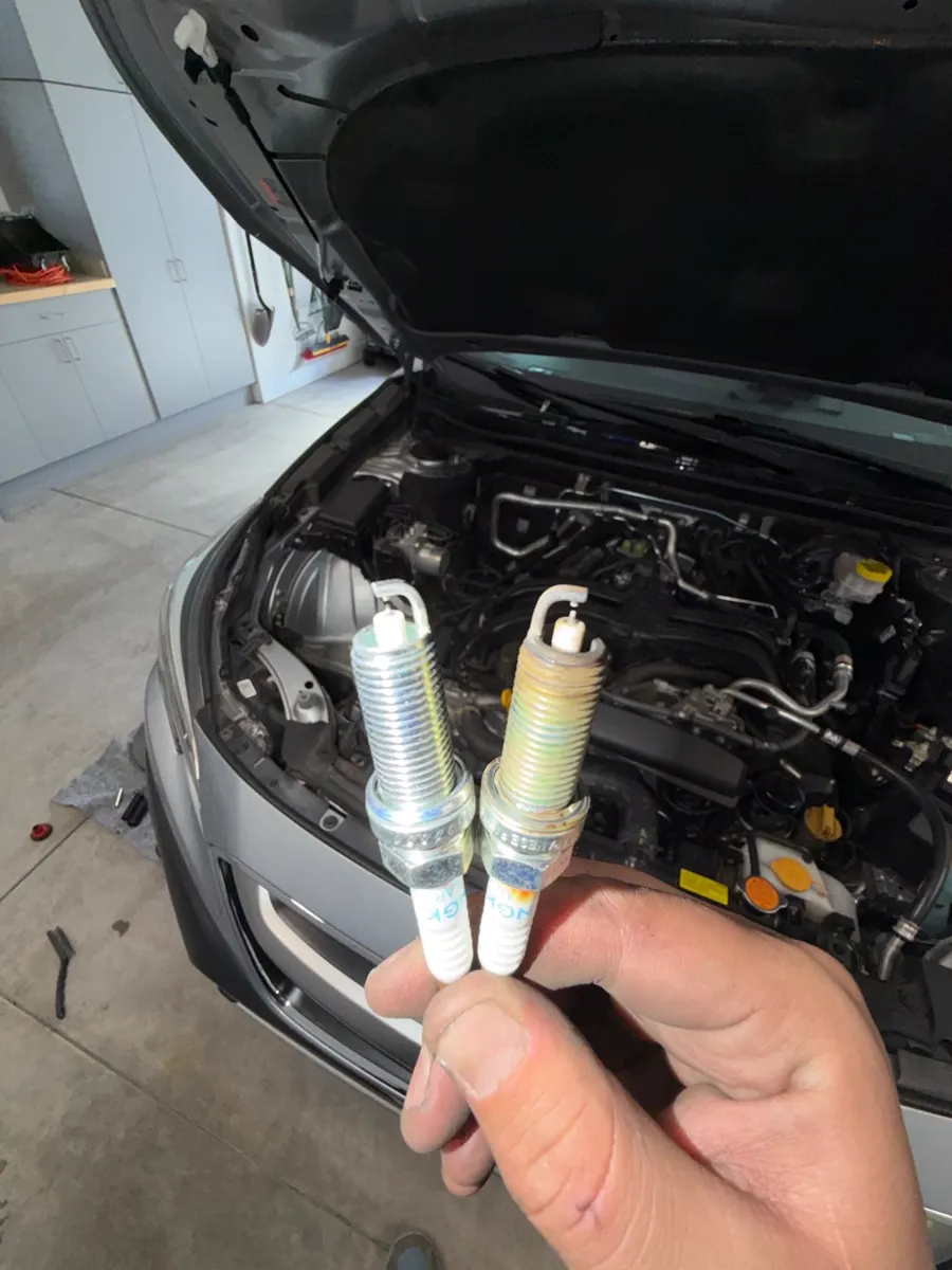 Old and new spark plugs