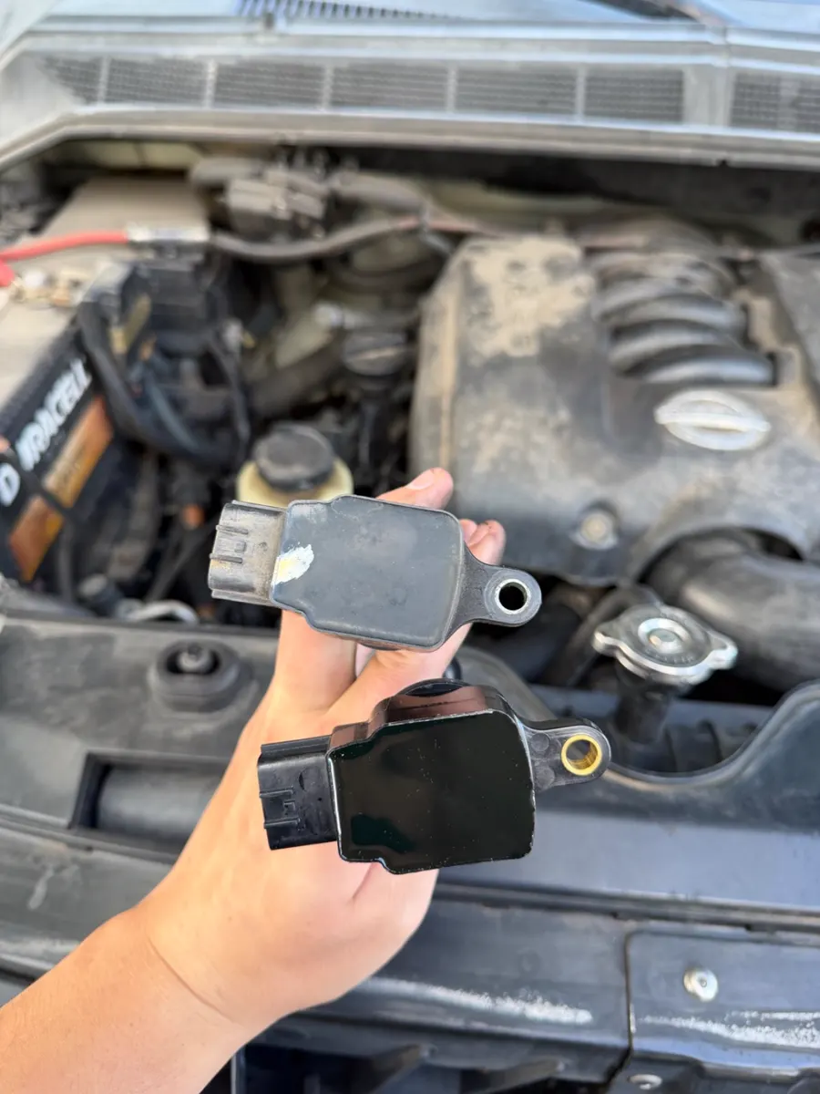 Failed coil pack next to the new replacement